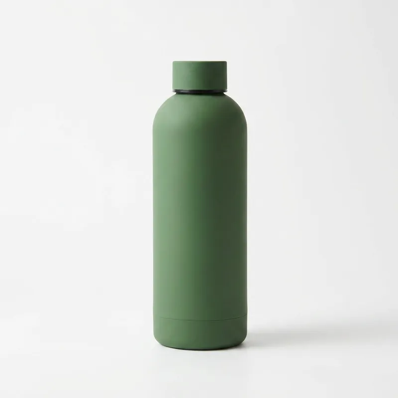 A green bottle on a plain white background